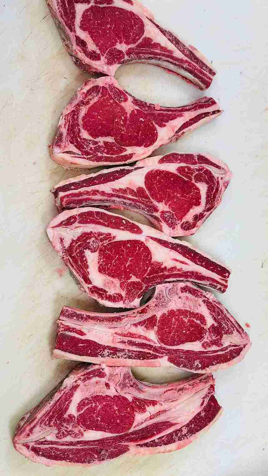 Butcher's Reserve Marbled Chops - Thick-cut Ribeye Steaks at Bismillah Grocery & Meat Market.